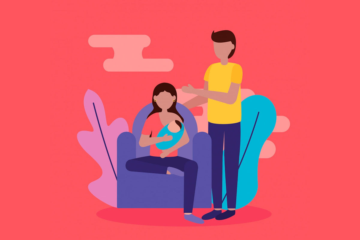 A lady sitting on chair with baby in her arms talking to a man 