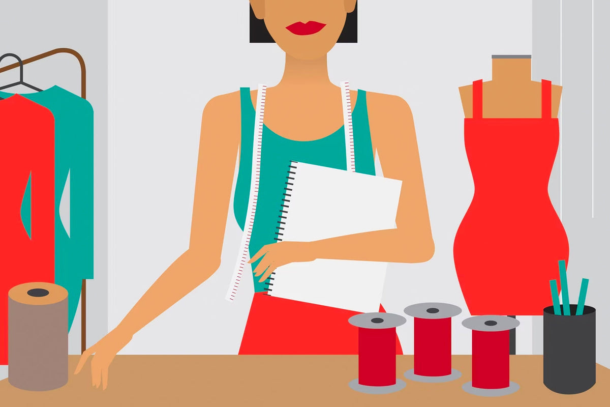 A tailor with red dress in the background with sewing kits in front on the table